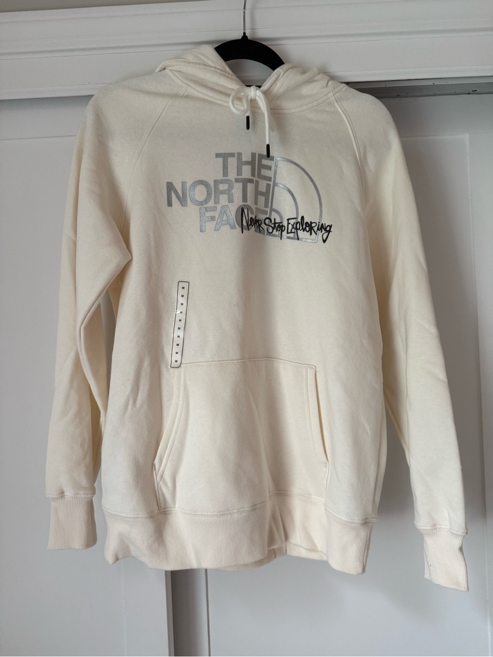 The North Face Off-White Pullover Hoodie with Silver Logo